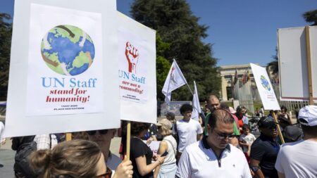Almost 500 staff protest against UN budget cuts in Geneva rally