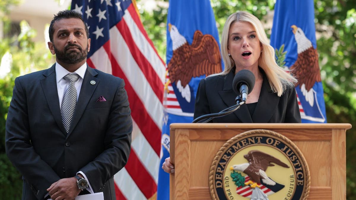 AG Pam Bondi at lectern with FBI director Kash Patel to her right