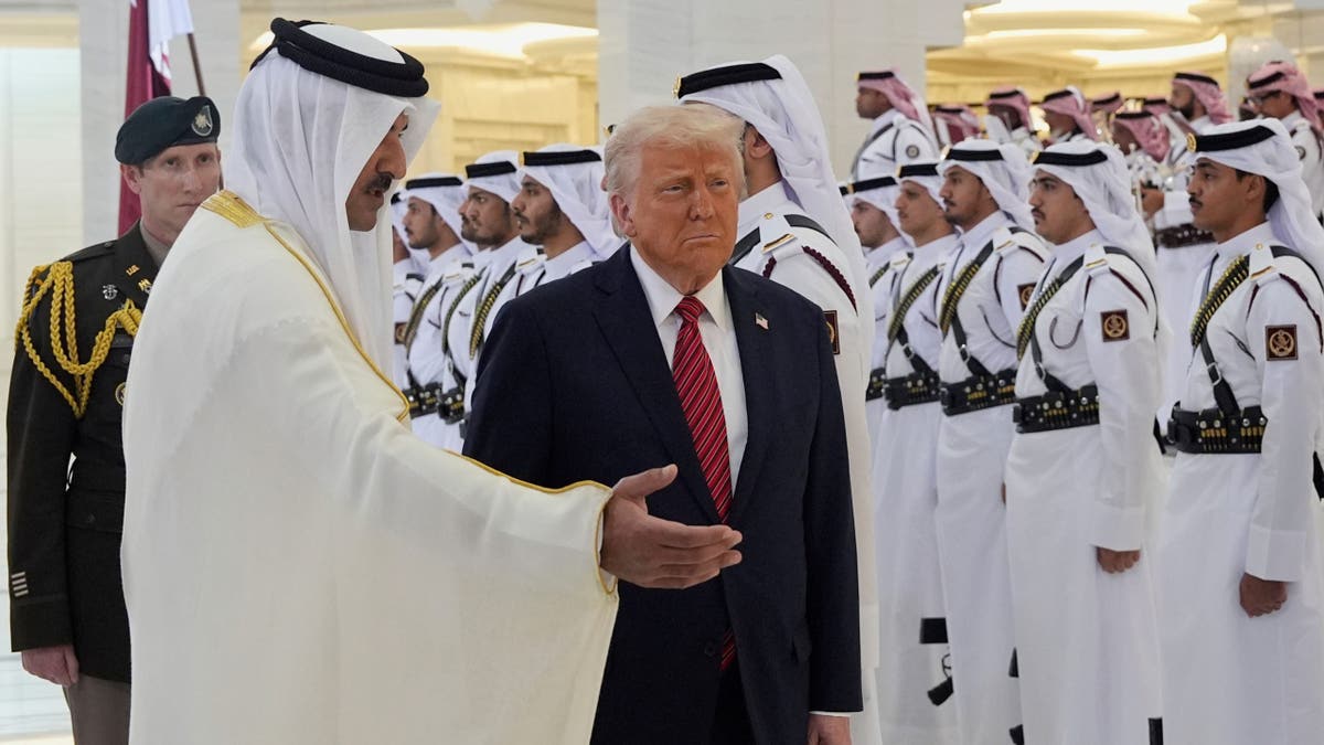 Qatar's Emir Sheikh Tamim bin Hamad Al Thani, left, welcomes President Donald Trump during an official welcoming ceremony at the Amiri Diwan in Doha, Qatar, on May 14, 2025.