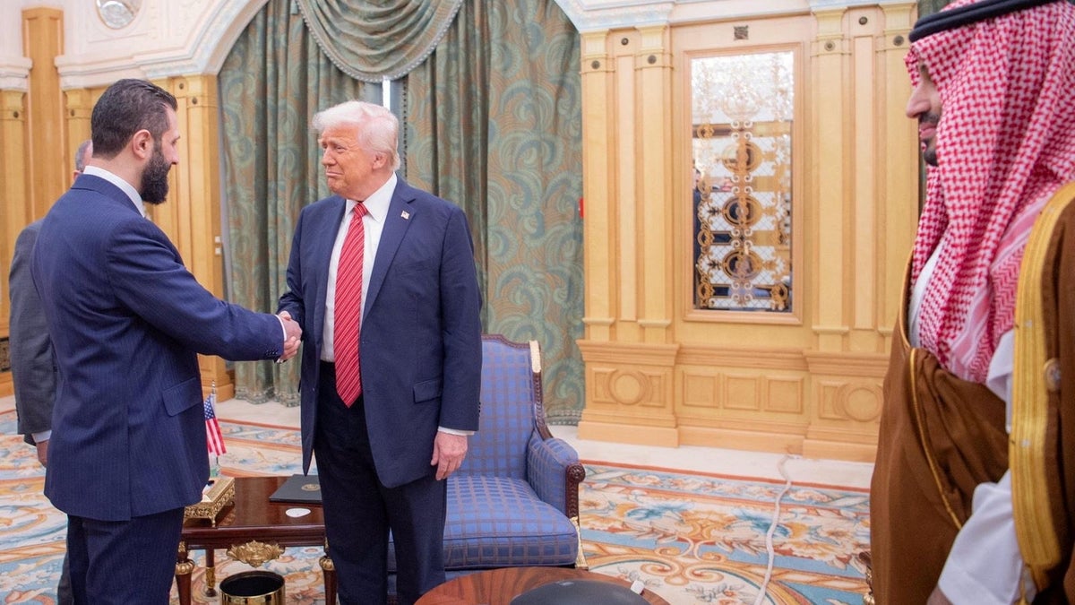 President Donald Trump, center, meets with Syrian President Ahmed al-Sharaa in Riyadh, Saudi Arabia, on May 14, 2025.