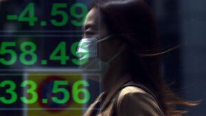 Dollar recovers some losses in Asia, stocks mixed as traders eye tariff deals