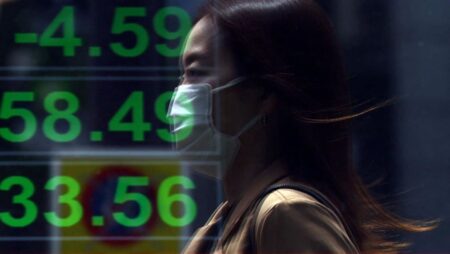 Dollar recovers some losses in Asia, stocks mixed as traders eye tariff deals