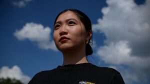 Hong Kong police arrest father and brother of wanted activist Anna Kwok