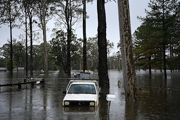A ute surrounded by floodwaters at Pampoolah.