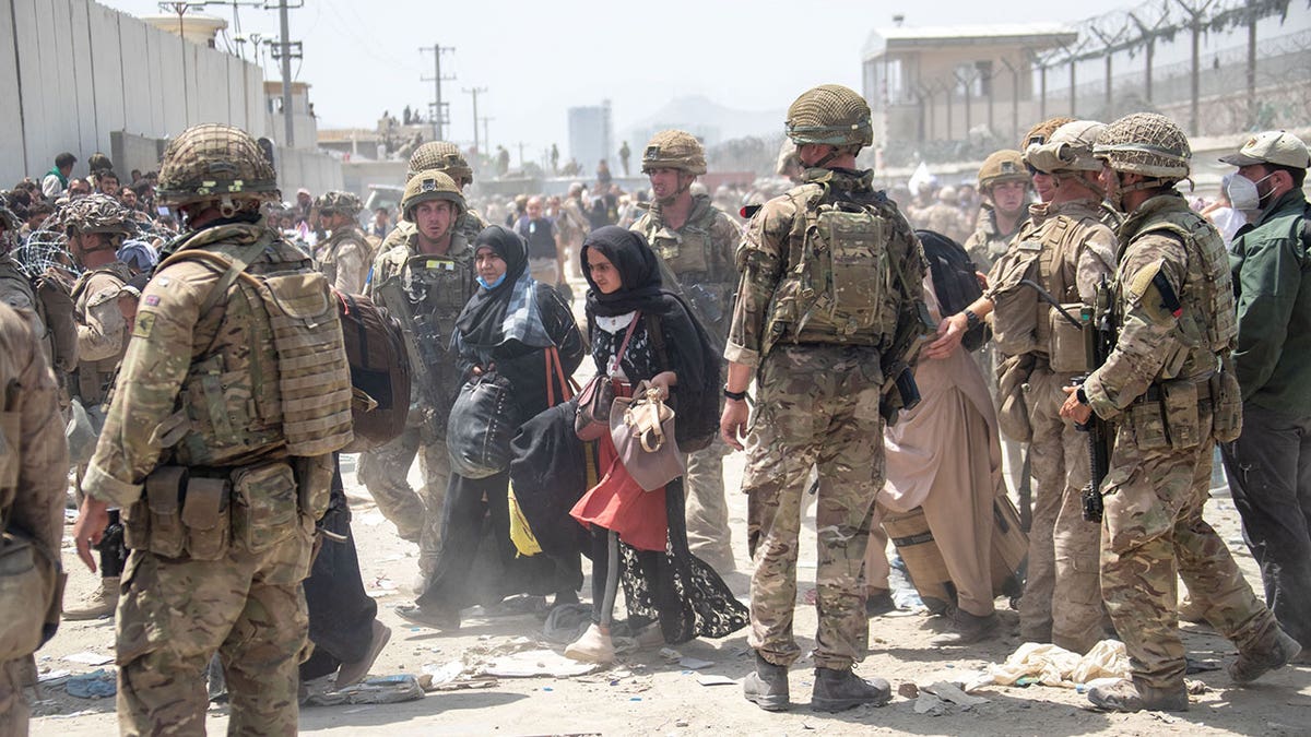 British armed forces work with the U.S. military to evacuate eligible civilians and their families out of the country on August 21, 2021 in Kabul, Afghanistan.