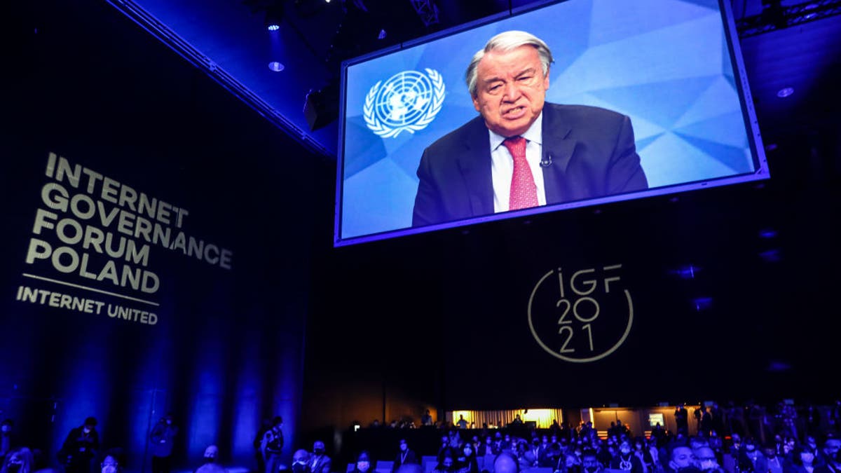 United Nations Secretary-General António Guterres is shown on the screen while speaking at the opening ceremony of the UN Internet Governance Forum - IGF 2021 at the International Congress Center in Katowice, Poland, on December 7th, 2021.