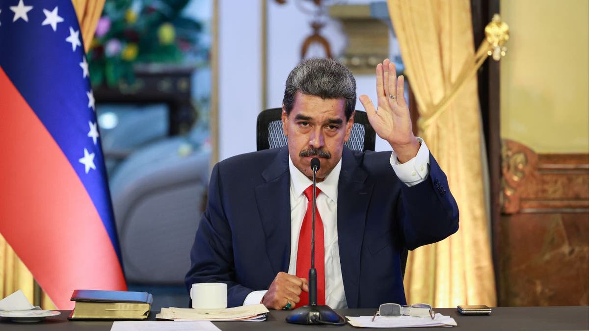 President Nicolas Maduro at desk