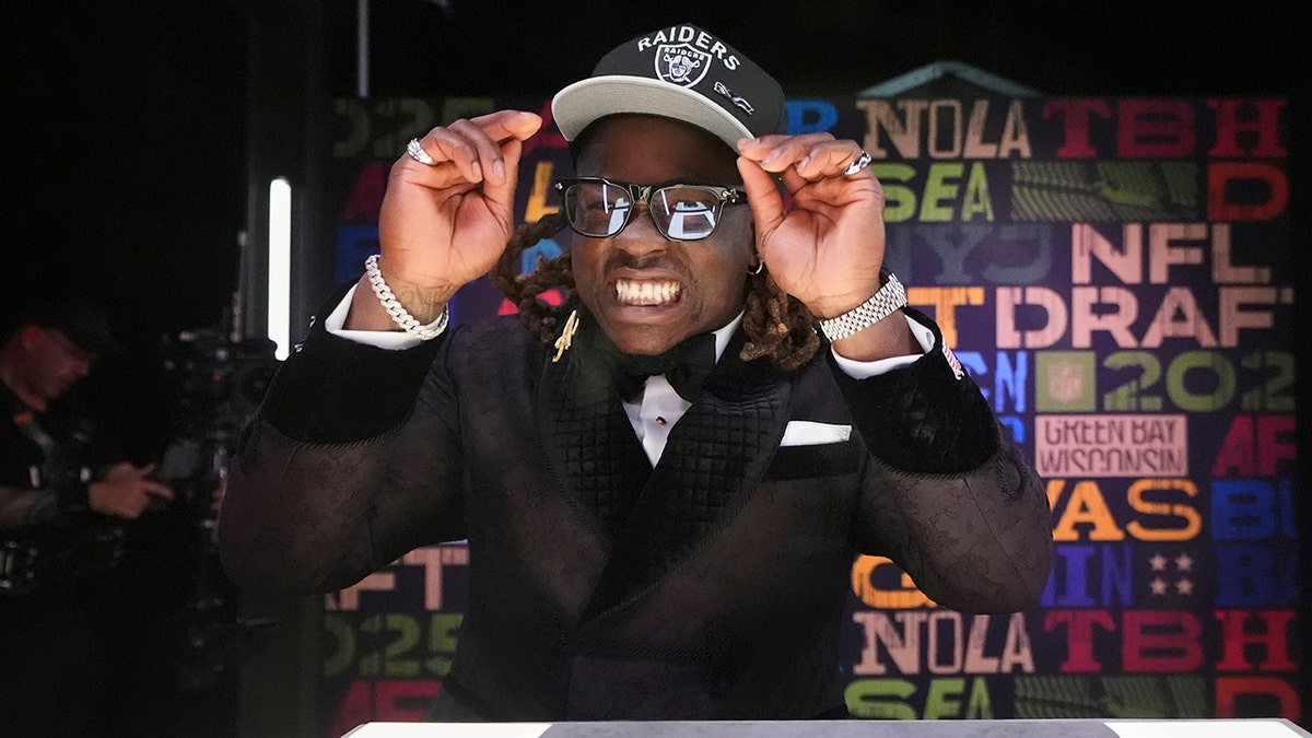 Ashton Jeanty checks his fit