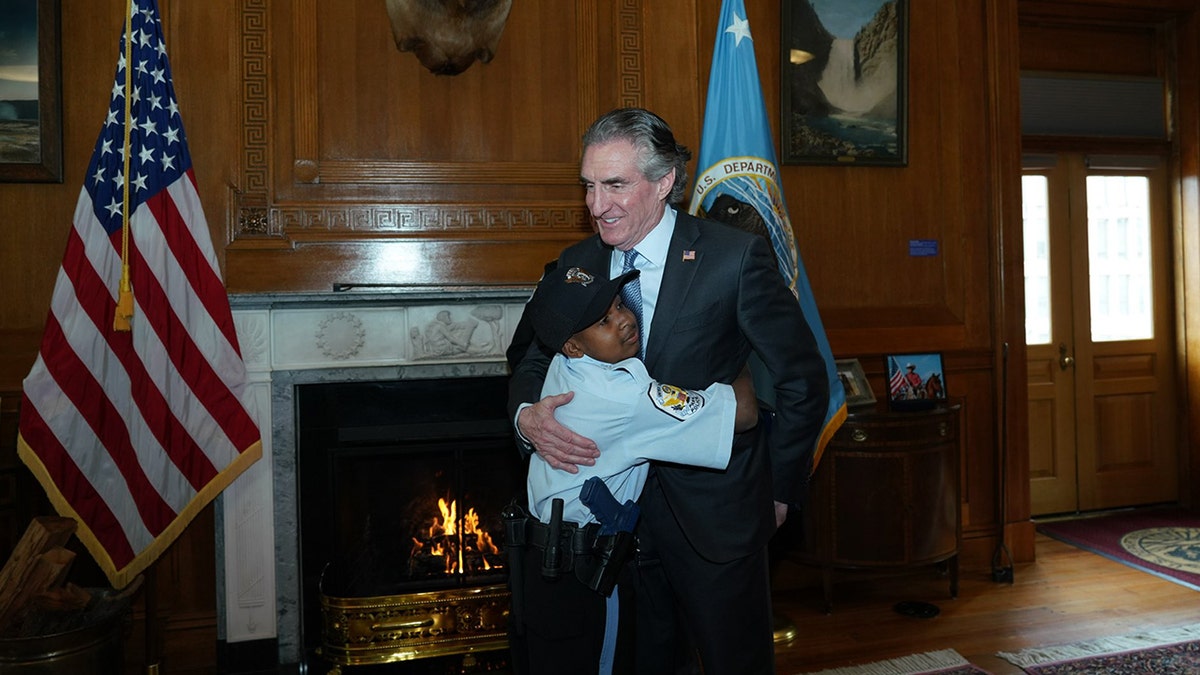 DJ Daniel hugging Doug Burgum