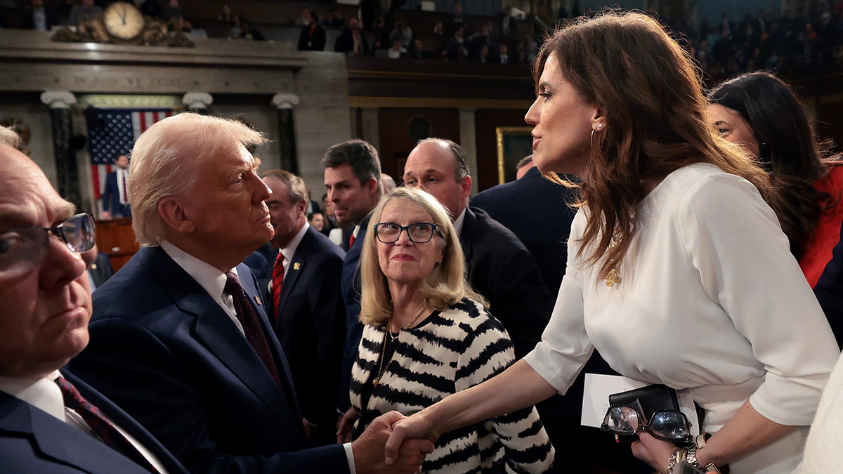 Donald Trump and Nancy Mace shaking hands