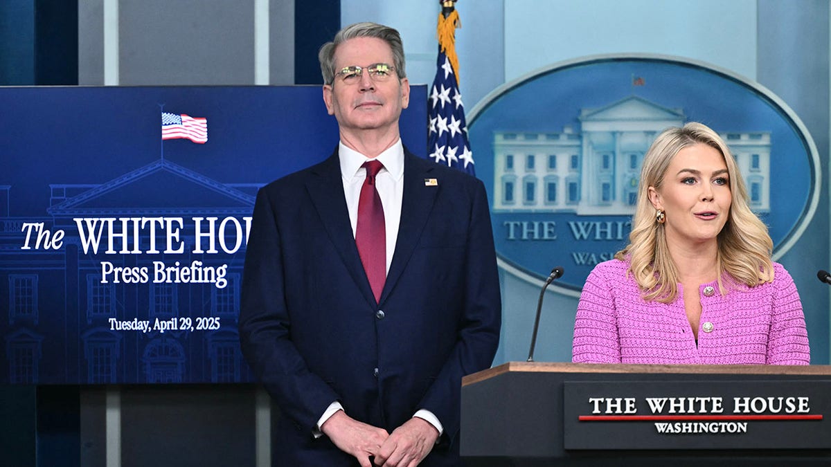 White House Press Secretary Karoline Leavitt speaks as US Secretary of Treasury Scott Bessent looks on during the daily briefing in the Brady Briefing Room of the White House in Washington, DC, on April 29, 2025.