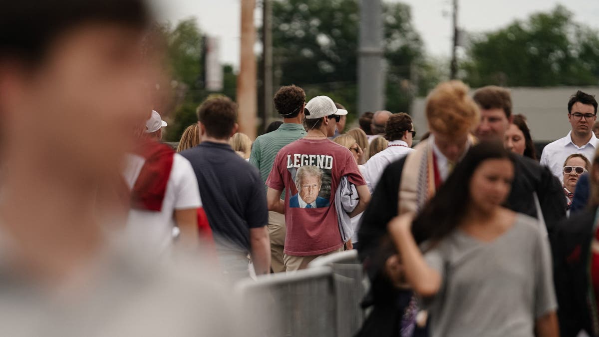 man wears pro-Trump shirt