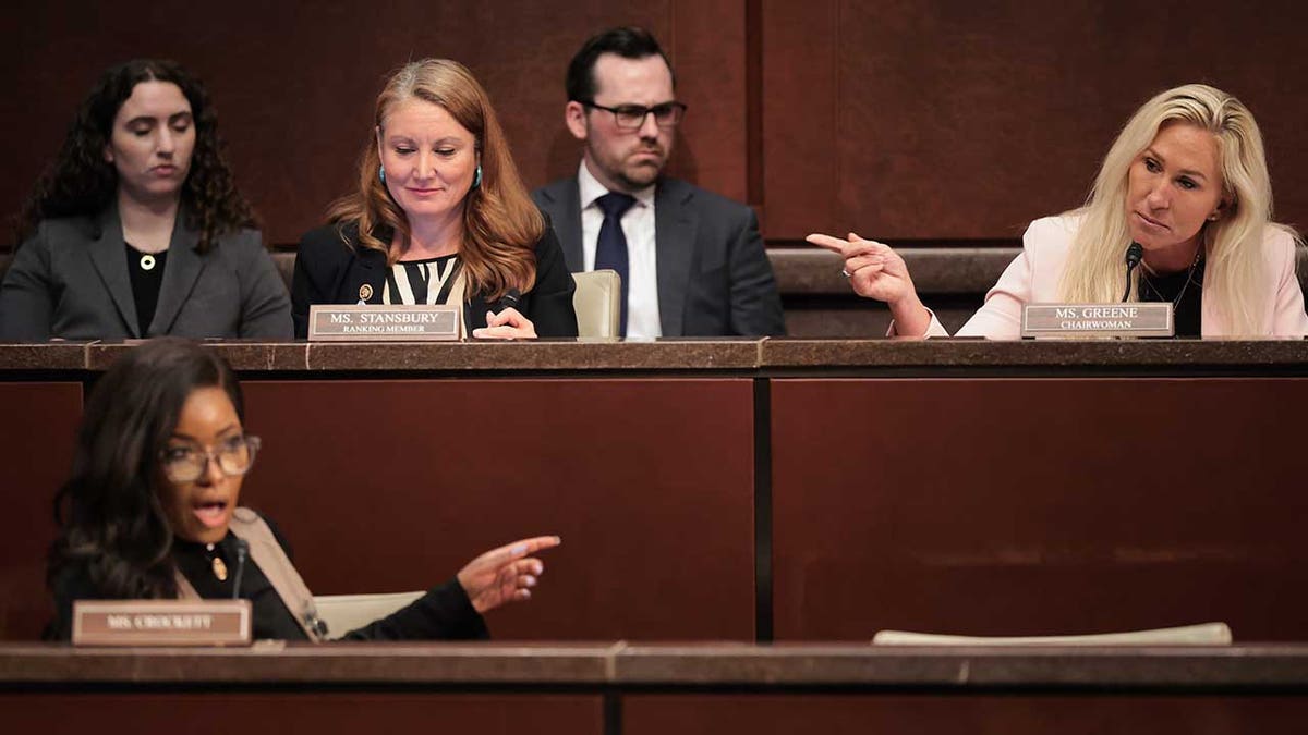 U.S. Rep. Jasmine Crockett (D-TX), Rep. Melanie Stansbury (D-NM), and Marjorie Taylor Greene (R-GA) speak during the hearing on "Unfair Play: Keeping Men Out of Women’s Sports" held by the Department of Government Efficiency (DOGE) Subcommittee at the U.S. Capitol on May 07, 2025 in Washington, DC.