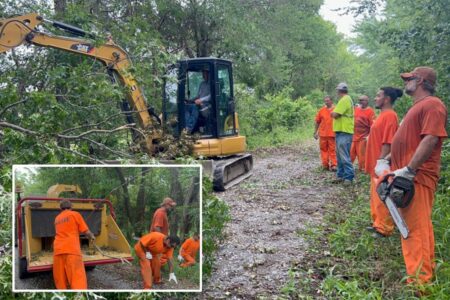 ‘Army of orange’ inmates rescue mother and 3 children who were stranded at home following destructive Oklahoma tornado