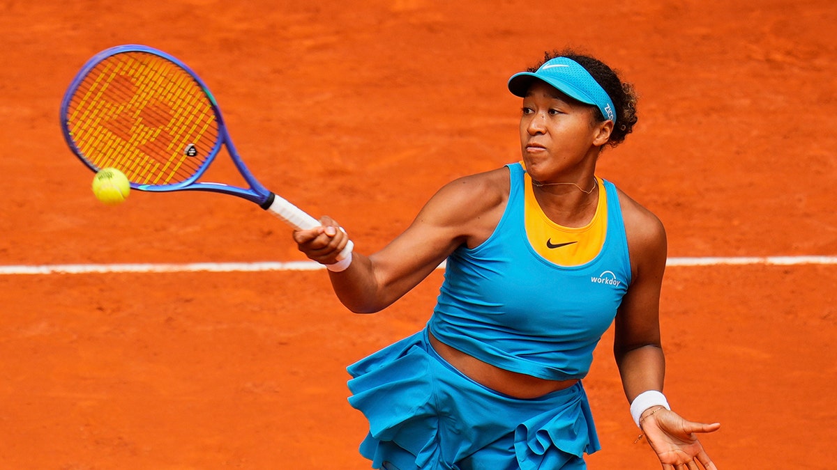 Naomi Osaka returns a shot