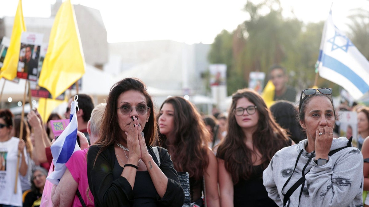 People gather in Hostages Square in Tel Aviv, Israel, ahead of Israeli-American Edan Alexander's expected release.