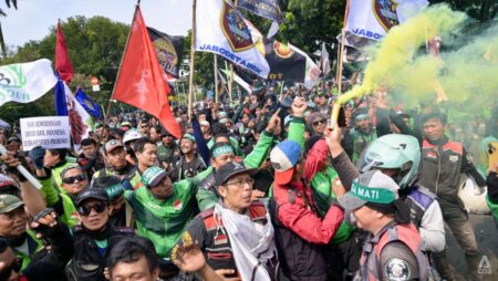 Ride-hailing drivers in Indonesia hold protests to demand better pay