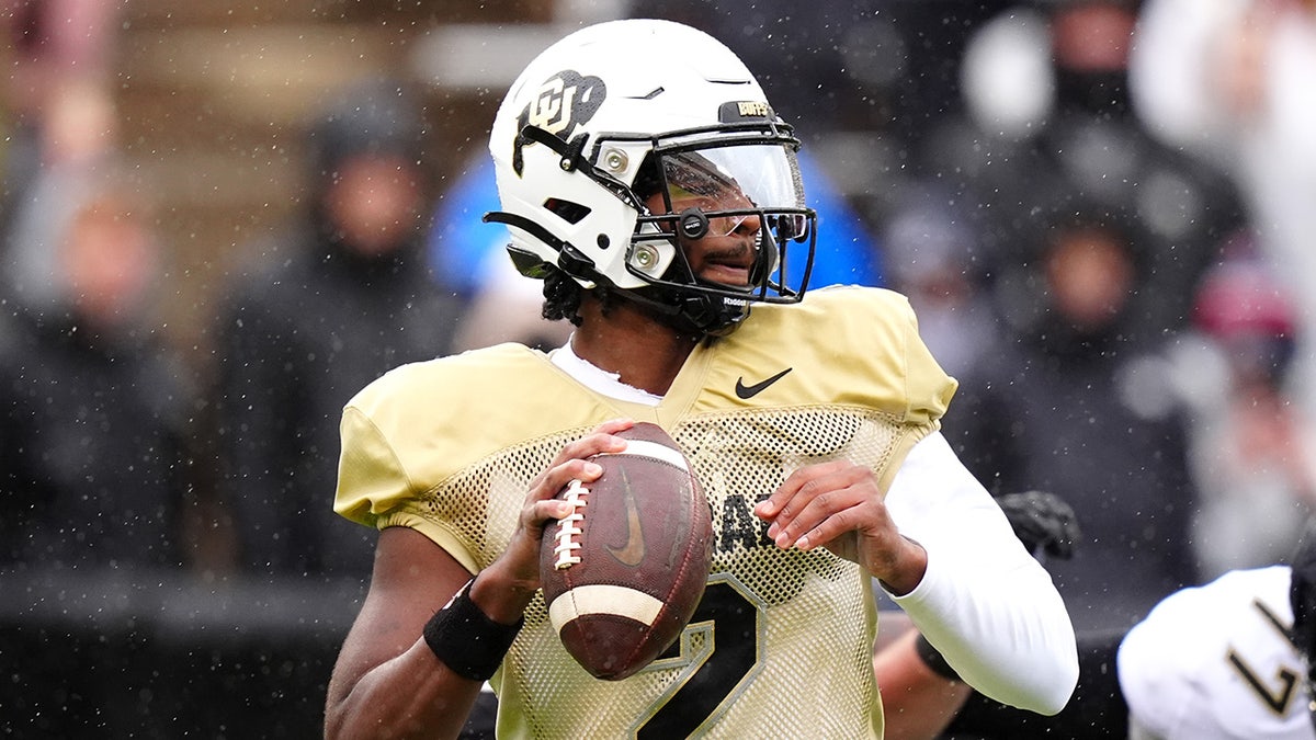 Shedeur Sanders looks to pass