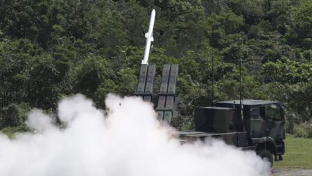 Taiwan president pledges peace with China but says island must strengthen defences