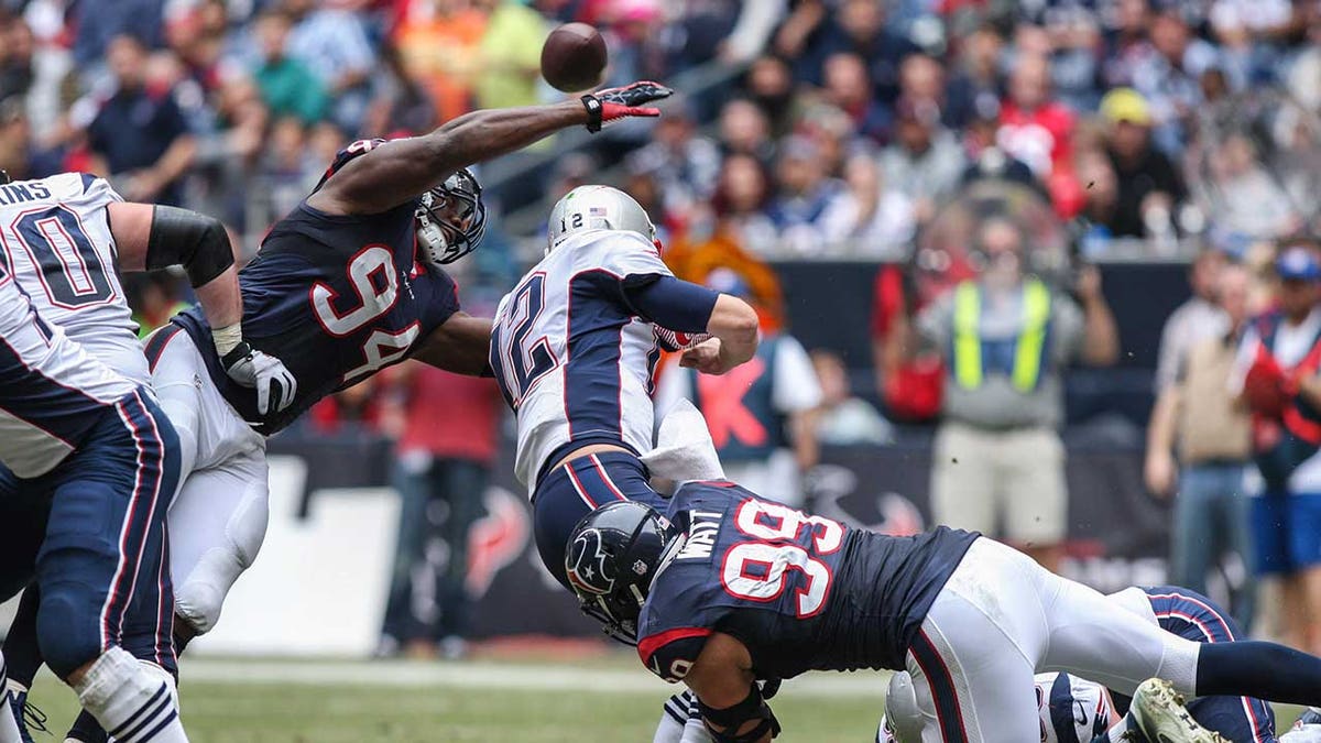 Tom Brady sacked by JJ Watt