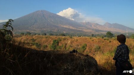 Indonesia rescuers try to reach Brazilian after fall at volcano