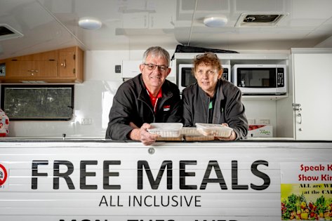 Lending a hand: John and Jennefer Houghton pictured in the Carevan where they volunteer once a week.