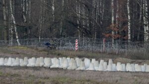 Poland adds minefields to border barriers with Russia