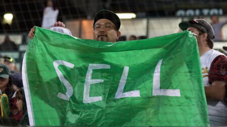 Athletics fan confronted by security for wearing ‘SELL’ t-shirt caught on live broadcast