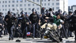 Los Angeles riot and protests put some NFL caliber tackles on display: WATCH