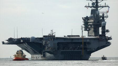 USS Nimitz carrier strike group sailing toward Middle East ahead of schedule, US official says