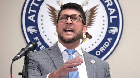 Florida attorney general held in contempt after challenging court’s block on immigration law