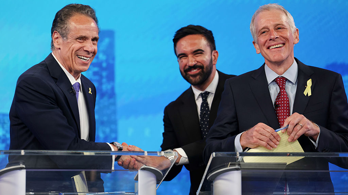 Cuomo laughing, shaking hands with Mamdani