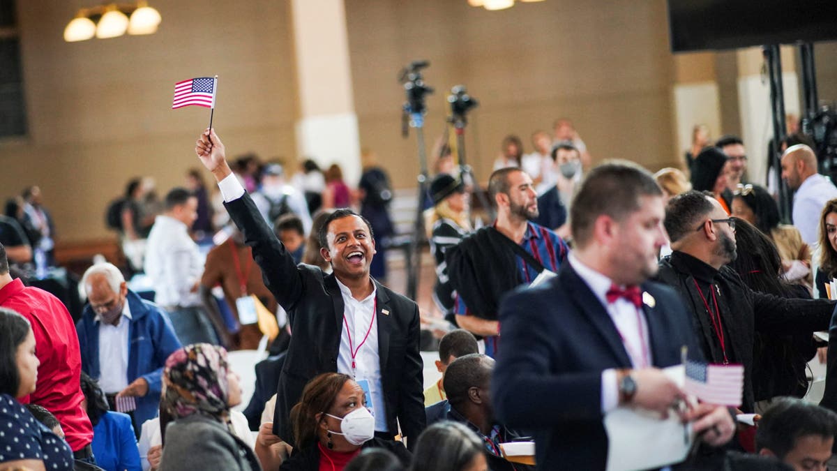 People get emotional after attending a naturalization ceremony at Ellis Island in New York, U.S., September 17, 2022.
