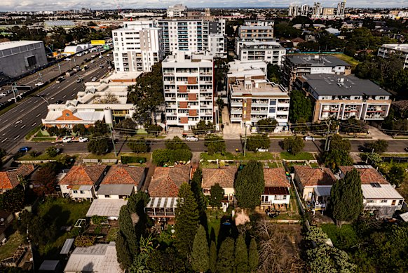 Across the busy James Ruse Drive, the suburb has become home to several new apartment blocks that loom over single-storey houses.