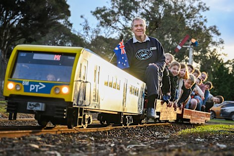 On track for fun: Richard Knight driving the miniature electric train he built for Mooroolbark Miniature Railway.