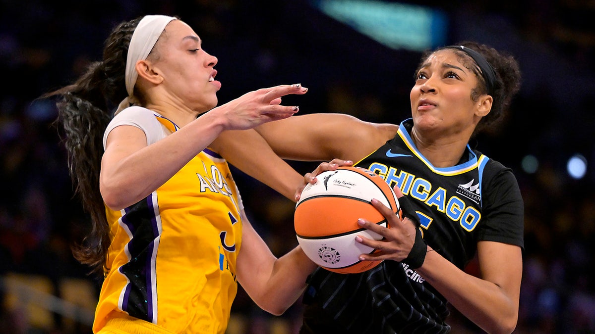 Angel Reese drives to basket