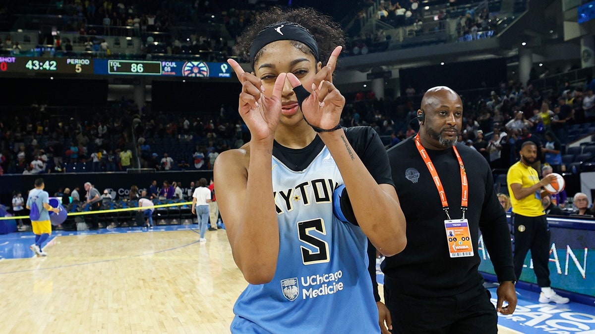 Angel Reese celebrates the win