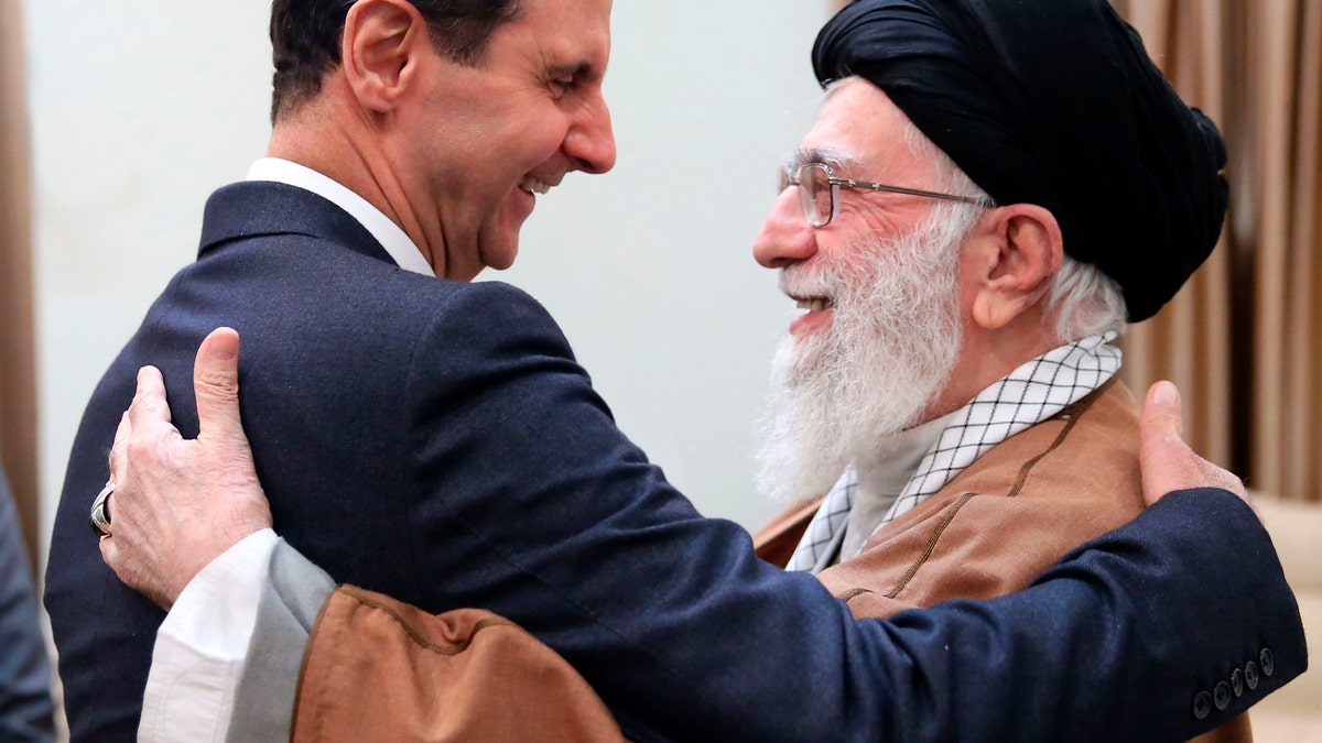 Iranian Supreme Leader Ayatollah Ali Khamenei, right, greets then-Syrian President Bashar Assad in Tehran, Iran, on Feb. 25, 2019.