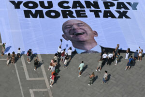 Giant Banner of Jeff Bezos’ Face Unveiled by Protesters in Venice
