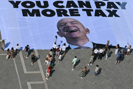 Giant Banner of Jeff Bezos’ Face Unveiled by Protesters in Venice