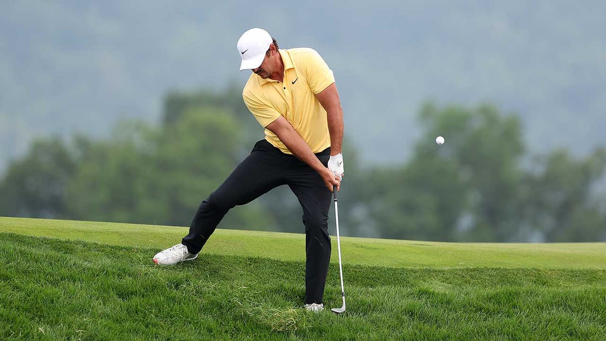 Brooks Koepka plays shot