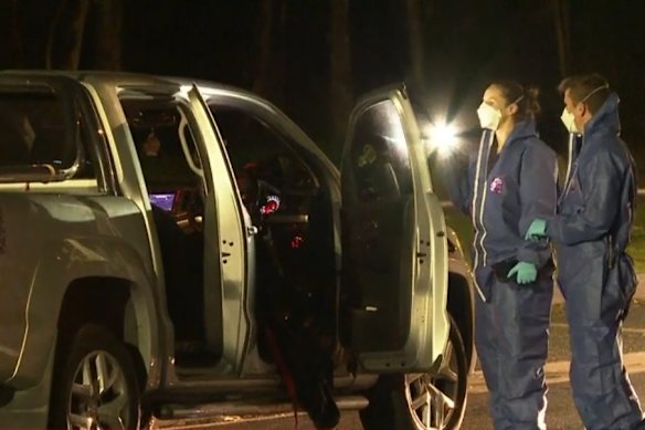 Police forensics officers gather evidence at the Pemulwuy scene.
