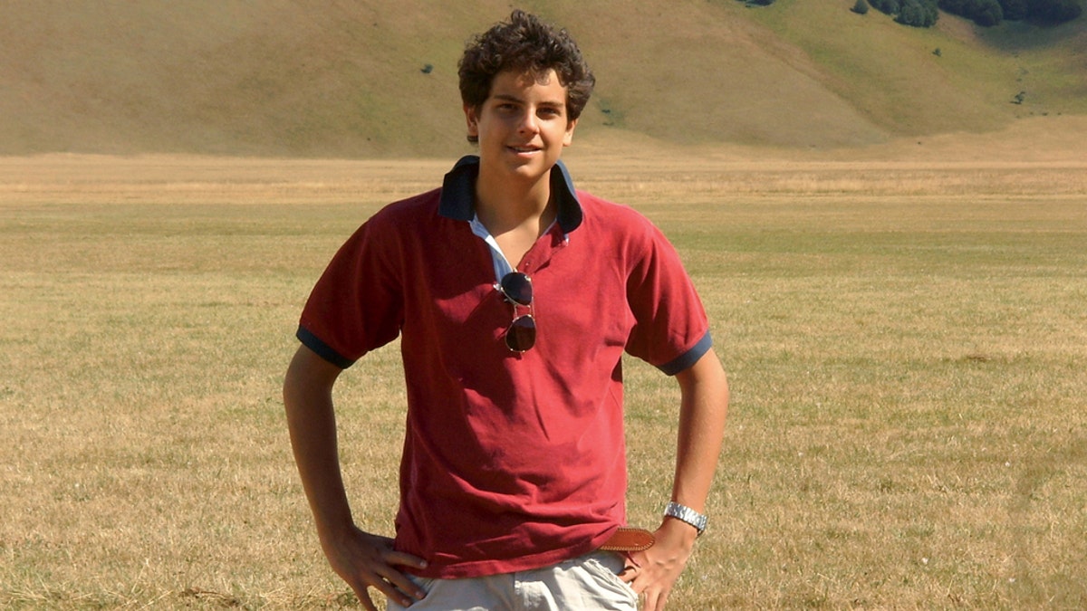 Carlo Actuis standing in a field
