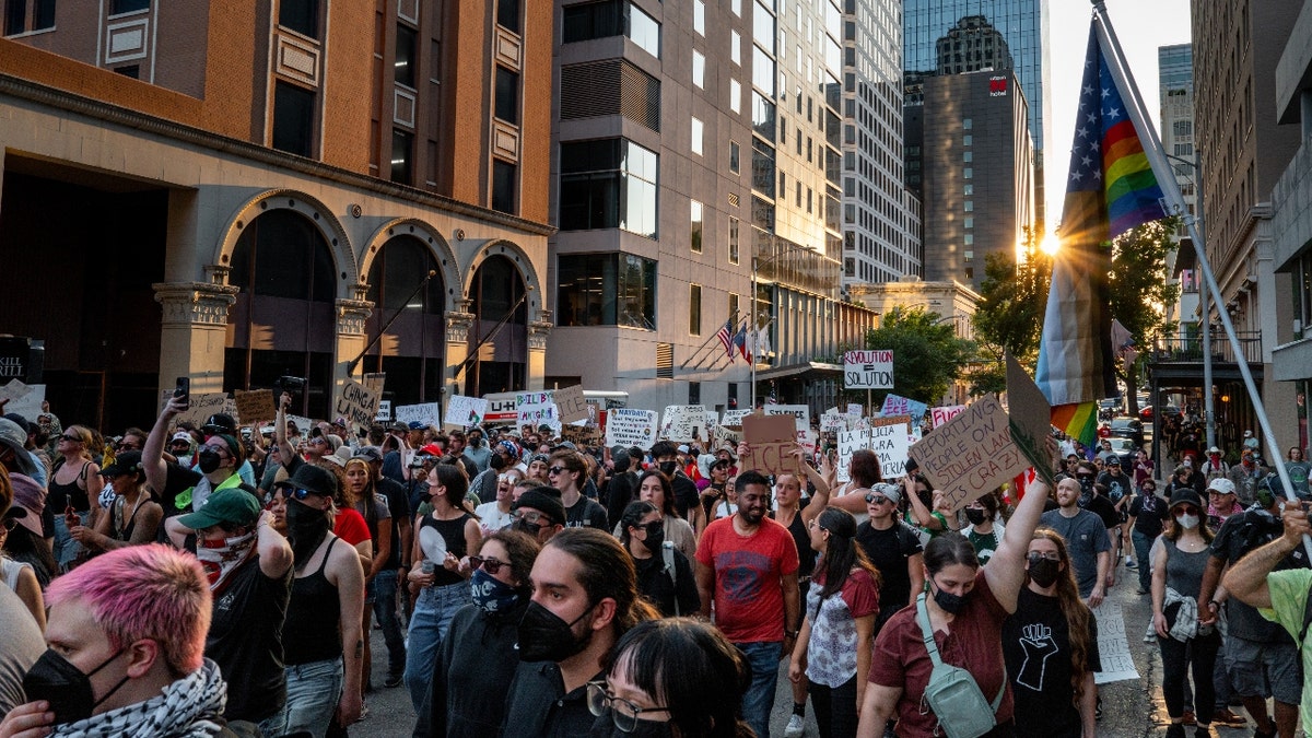 People march through downtown during an "ICE Out of Austin" demonstration on June 09, 2025 in Austin, Texas. People gathered during an emergency protest against the ongoing ICE (U.S. Immigration and Customs Enforcement) raids and deportations across Los Angeles.