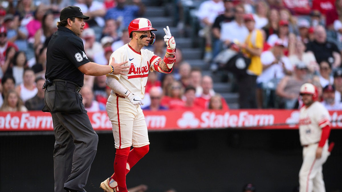 Zach Neto gestures towards Hunter Brown