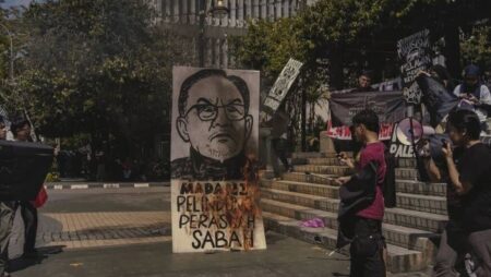 ‘Extreme, disrespectful’: Sabah student activists face police probe after caricature of PM Anwar set ablaze in anti-graft rally