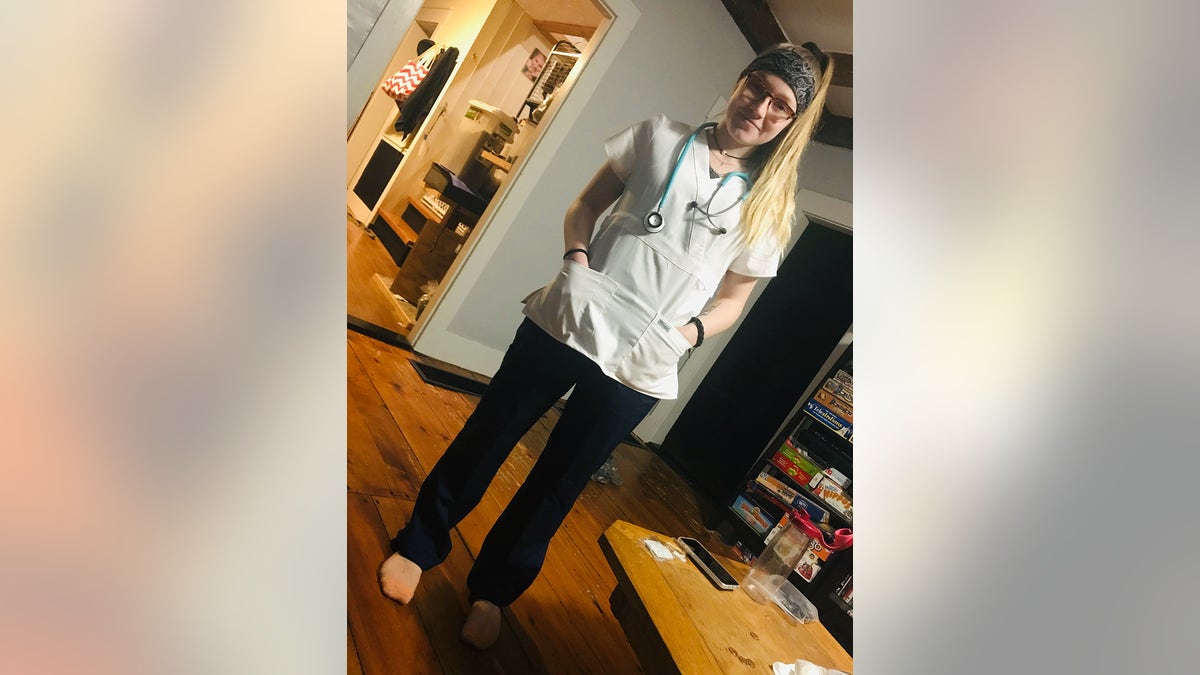 Emily Ferlazzo wearing her nurse uniform.