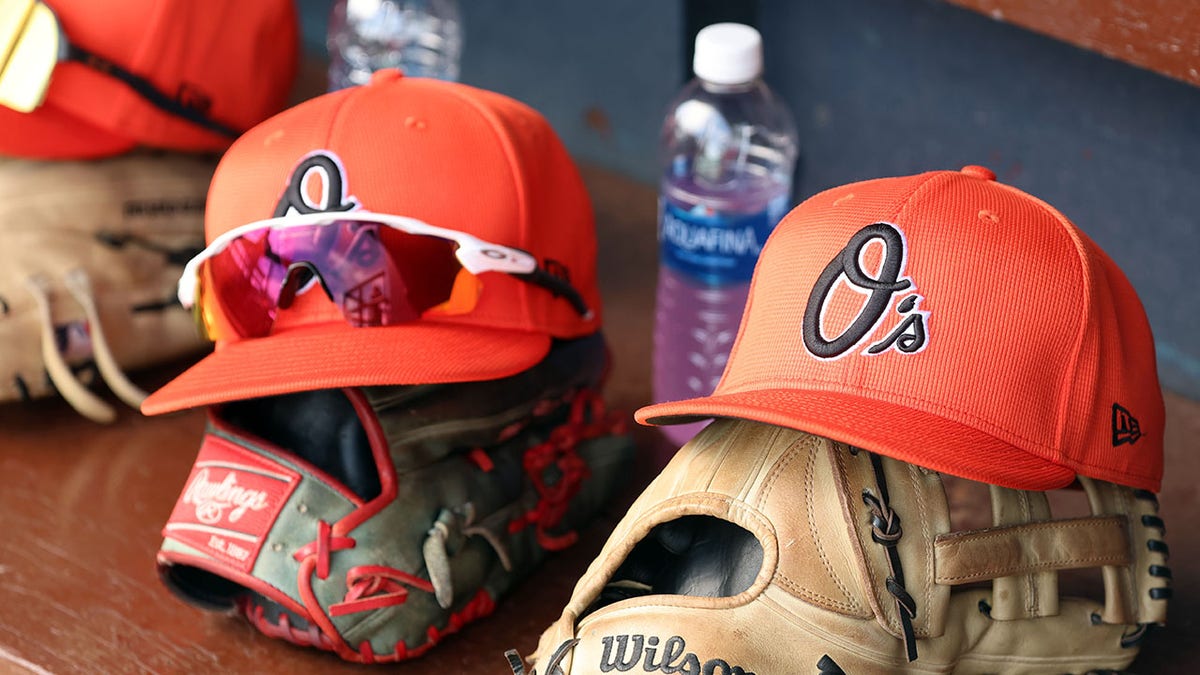 An Orioles cap in the dugout