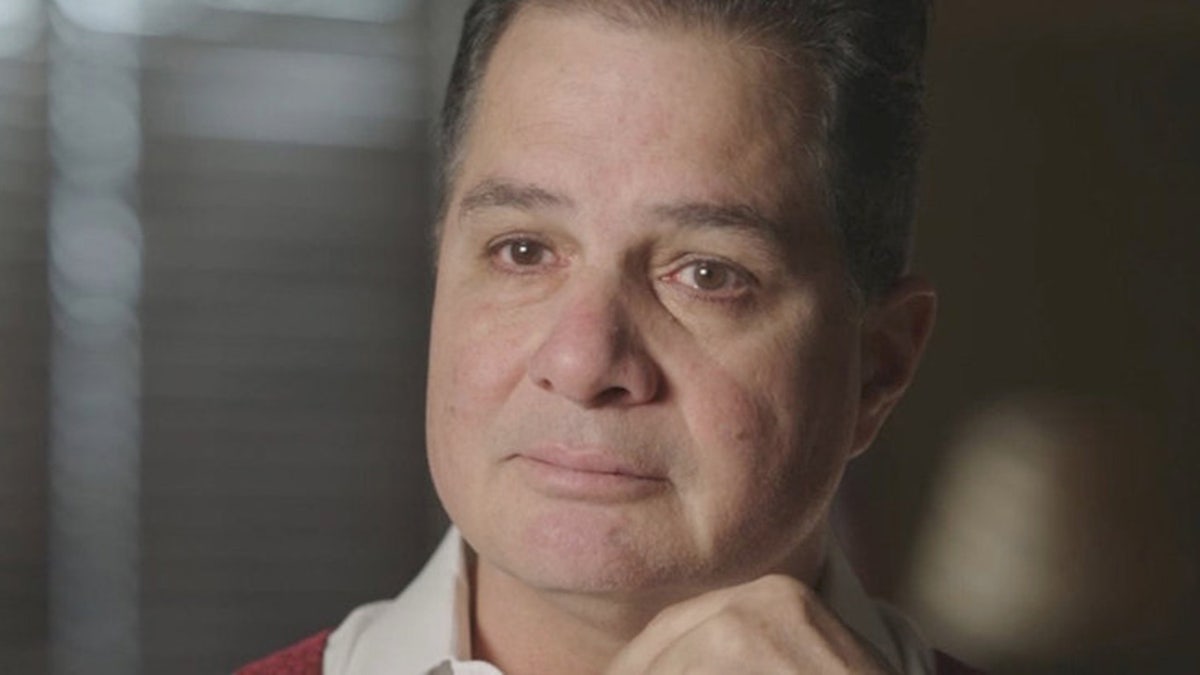 A close-up of David Jimenez looking serious.