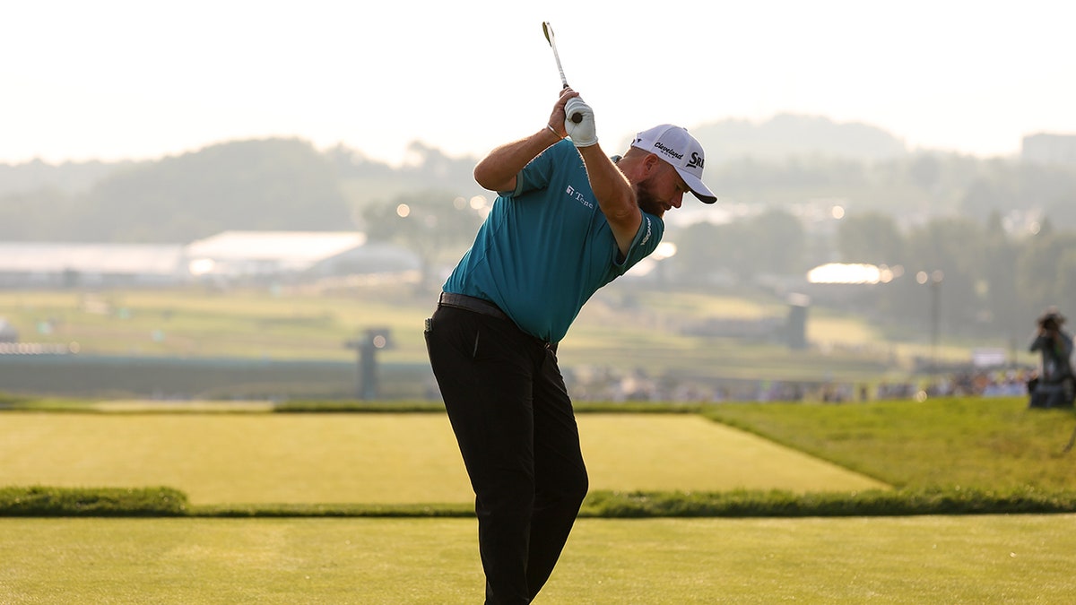 Shane Lowry hits a golf ball